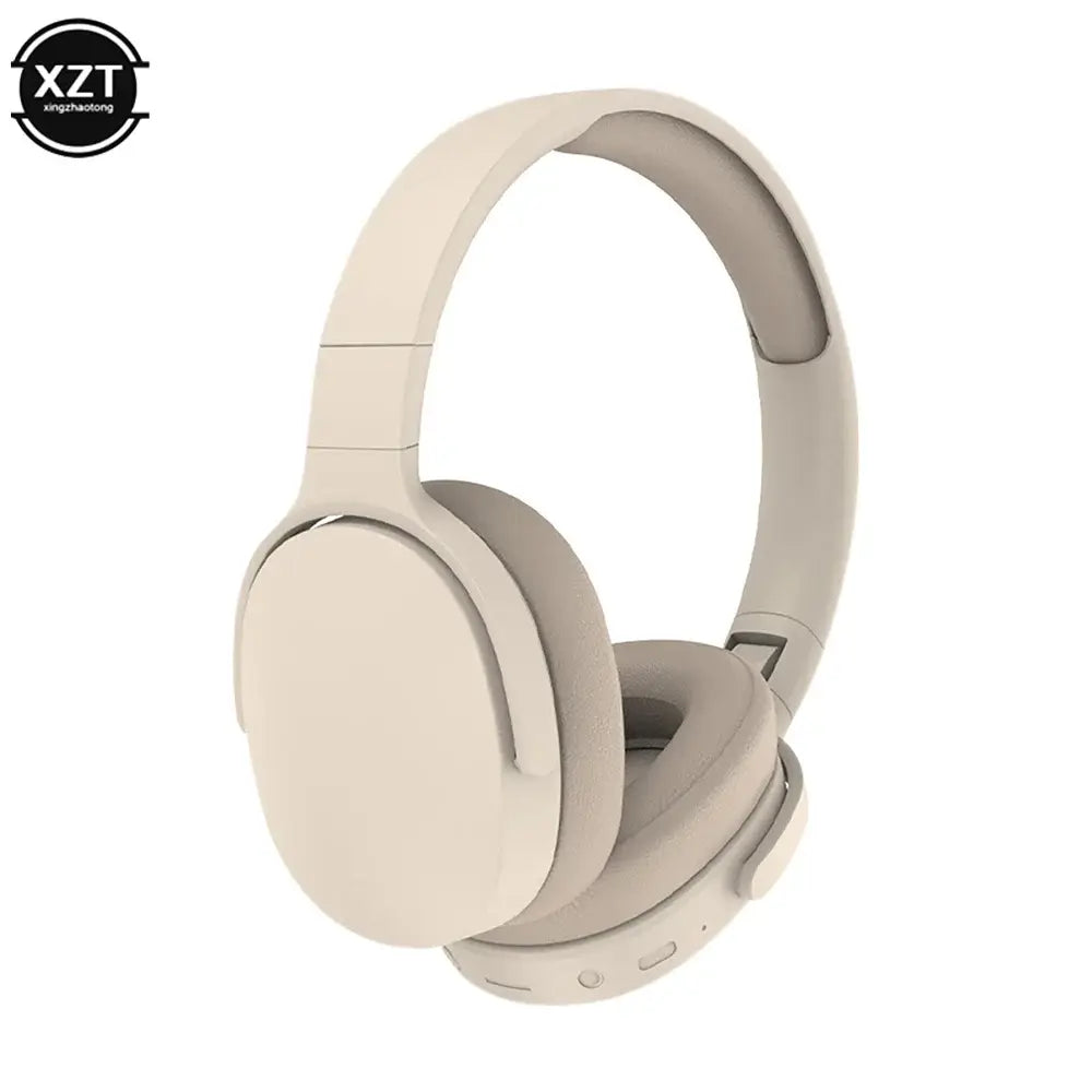 Wireless Bluetooth earphone in sleek beige design with comfortable ear cushions and control buttons, ideal for gaming and PC use.