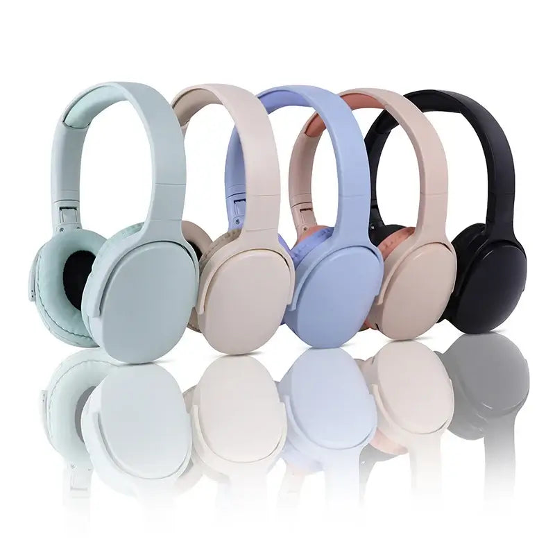 Four stylish wireless headphones in pastel colors: blue, pink, beige, and black, showcasing modern design and comfort.